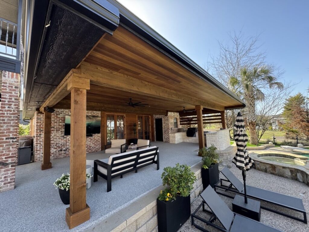New custom build for outdoor living in Heath, Texas - patio cover, outdoor kitchen, custom wood work and stone work, plus raised beds, turf, and screens.