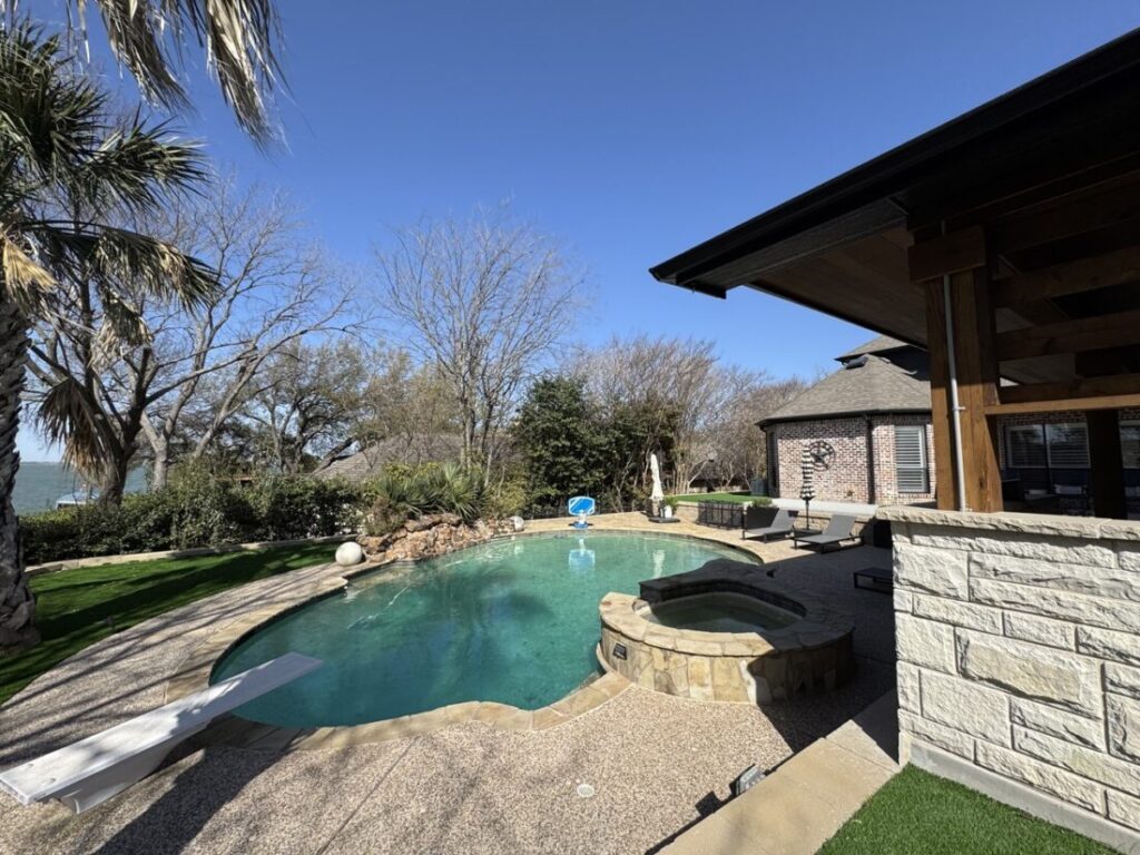 New custom build for outdoor living in Heath, Texas - patio cover, outdoor kitchen, custom wood work and stone work, plus raised beds, turf, and screens.