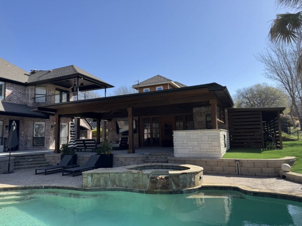 New custom build for outdoor living in Heath, Texas - patio cover, outdoor kitchen, custom wood work and stone work, plus raised beds, turf, and screens.