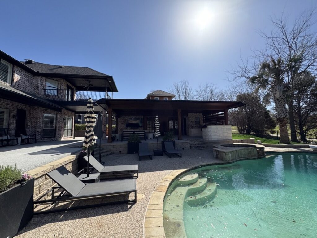 New custom build for outdoor living in Heath, Texas - patio cover, outdoor kitchen, custom wood work and stone work, plus raised beds, turf, and screens.