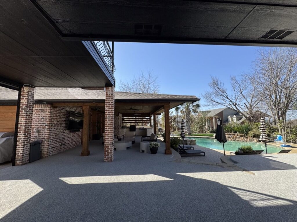 New custom build for outdoor living in Heath, Texas - patio cover, outdoor kitchen, custom wood work and stone work, plus raised beds, turf, and screens.