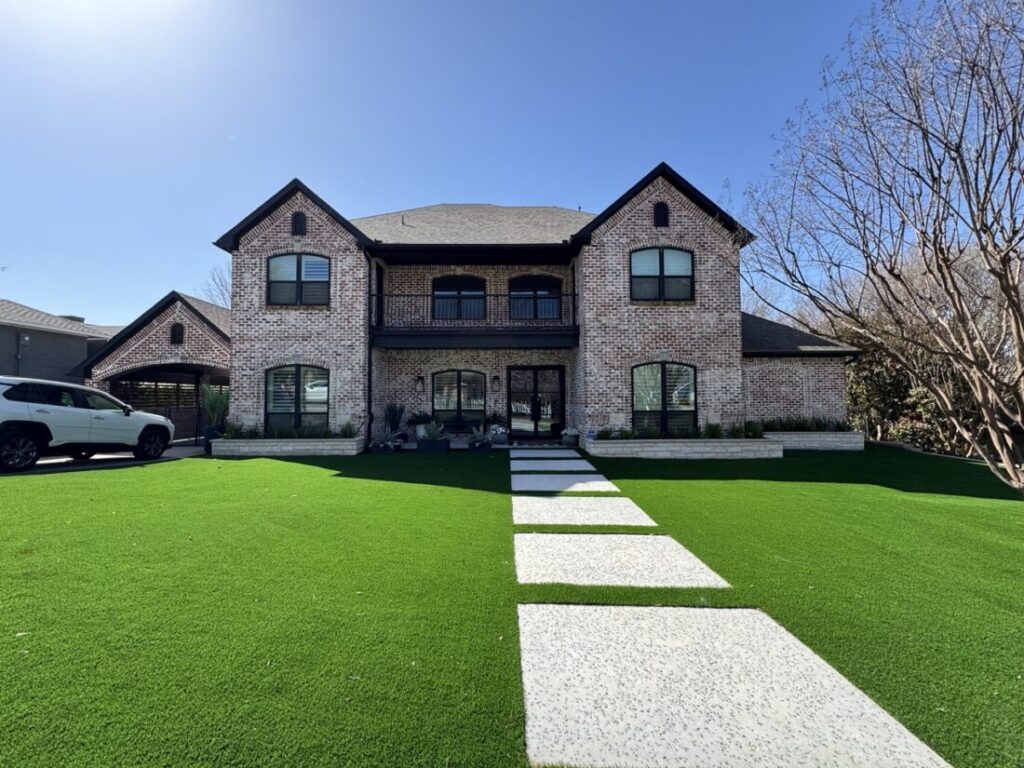 New custom build for outdoor living in Heath, Texas - patio cover, outdoor kitchen, custom wood work and stone work, plus raised beds, turf, and screens.