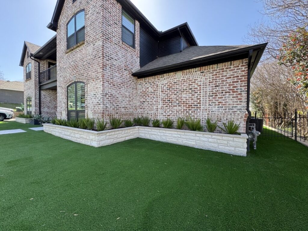 New custom build for outdoor living in Heath, Texas - patio cover, outdoor kitchen, custom wood work and stone work, plus raised beds, turf, and screens.