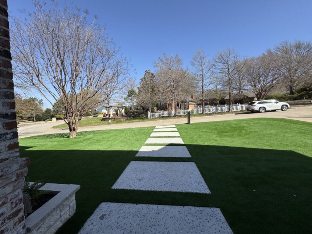 New custom build for outdoor living in Heath, Texas - patio cover, outdoor kitchen, custom wood work and stone work, plus raised beds, turf, and screens.
