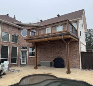 New back porch balcony and patio cover custom built in Rockwall by the experts in outdoor living in North Texas - Buildometry!