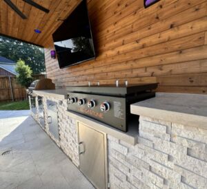 New outdoor kitchen and bar custom built by Buildometry in North Texas