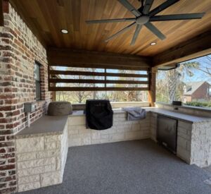 New custom build for outdoor living in Heath, Texas - patio cover, outdoor kitchen, custom wood work and stone work, plus raised beds, turf, and screens.