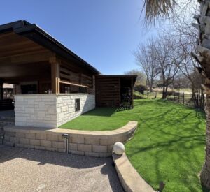 New custom build for outdoor living in Heath, Texas - patio cover, outdoor kitchen, custom wood work and stone work, plus raised beds, turf, and screens.