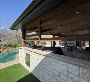 New custom build for outdoor living in Heath, Texas - patio cover, outdoor kitchen, custom wood work and stone work, plus raised beds, turf, and screens.