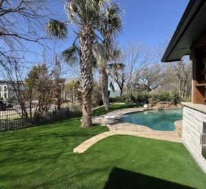 New custom build for outdoor living in Heath, Texas - patio cover, outdoor kitchen, custom wood work and stone work, plus raised beds, turf, and screens.
