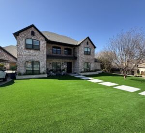 New custom build for outdoor living in Heath, Texas - patio cover, outdoor kitchen, custom wood work and stone work, plus raised beds, turf, and screens.