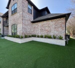 New custom build for outdoor living in Heath, Texas - patio cover, outdoor kitchen, custom wood work and stone work, plus raised beds, turf, and screens.