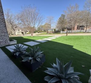 New custom build for outdoor living in Heath, Texas - patio cover, outdoor kitchen, custom wood work and stone work, plus raised beds, turf, and screens.