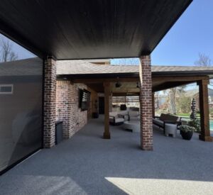 New custom build for outdoor living in Heath, Texas - patio cover, outdoor kitchen, custom wood work and stone work, plus raised beds, turf, and screens.