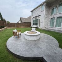 New Custom Outdoor Living Project in Rockwall, TX by the experts at Buildometry - custom stone and concrete fire pit