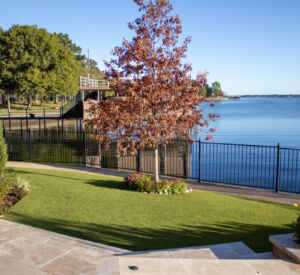 Built by Firehouse Pools Outdoor Living Builder - artificial turf, fencing